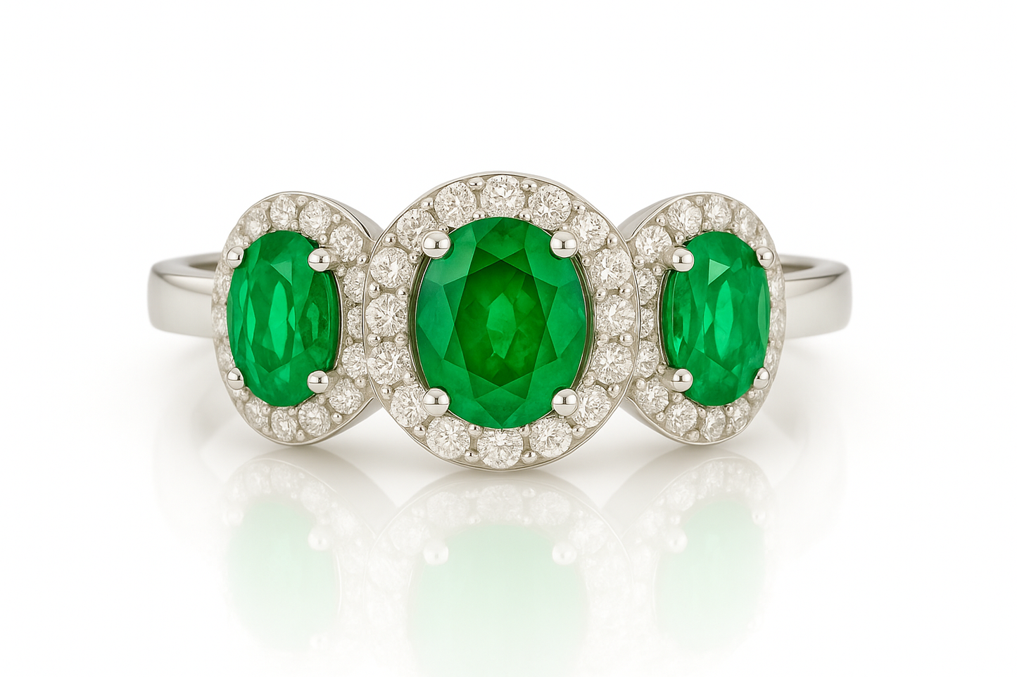 Trilogy Emerald Ring – Center Oval 7x5 mm with Side 5x4 mm Emeralds and Diamond Halo