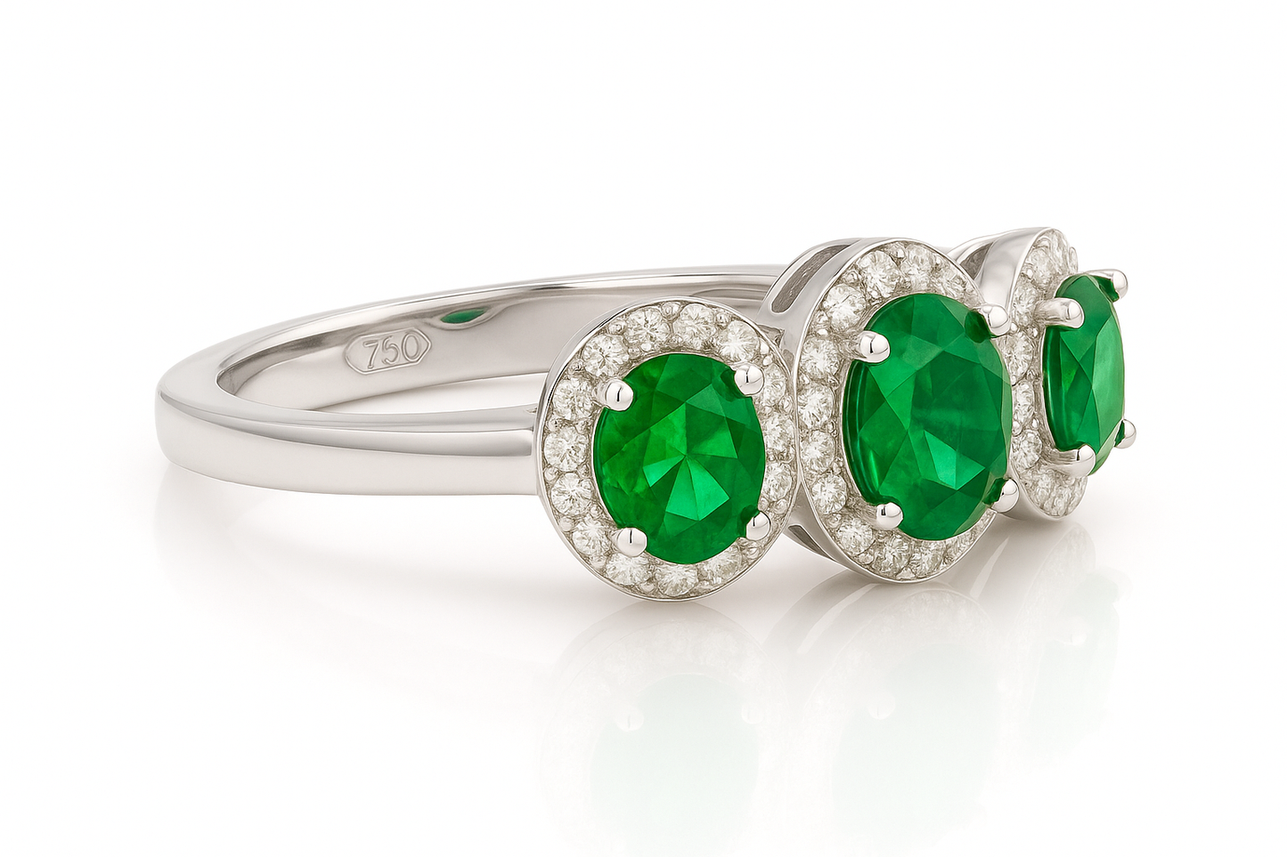 Trilogy Emerald Ring – Center Oval 7x5 mm with Side 5x4 mm Emeralds and Diamond Halo