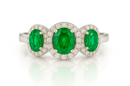 Trilogy Emerald Ring – Center Oval 7x5 mm with Side 5x4 mm Emeralds and Diamond Halo