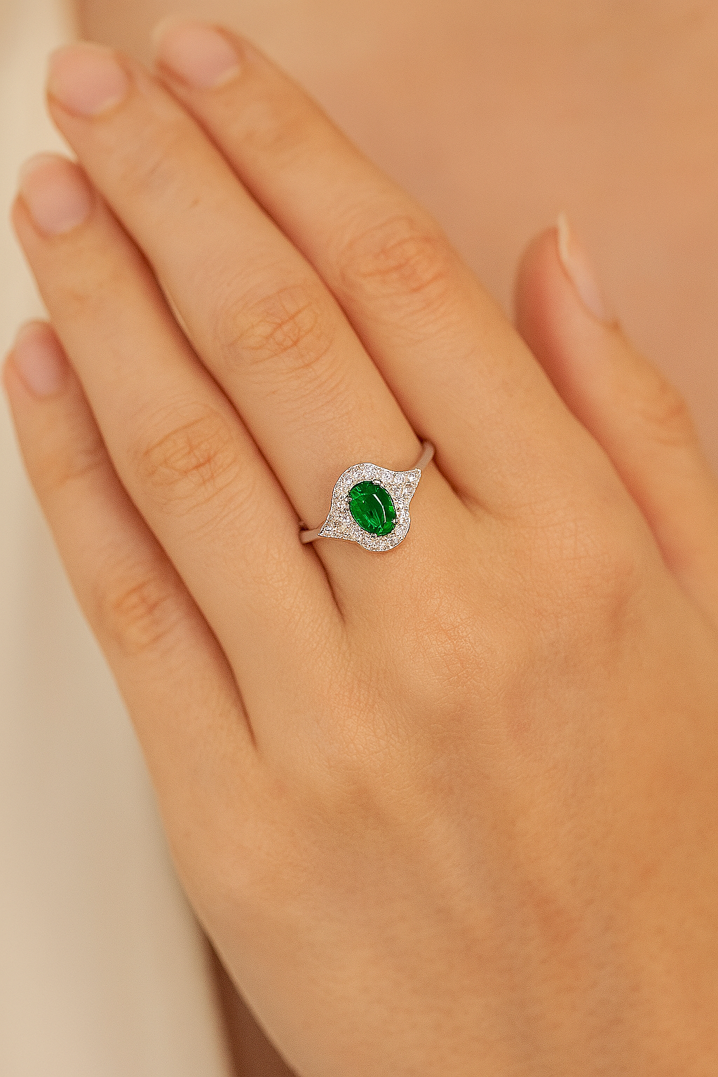 Oval Emerald (6x4mm) Ring with Diamond Halo and Side Accents
