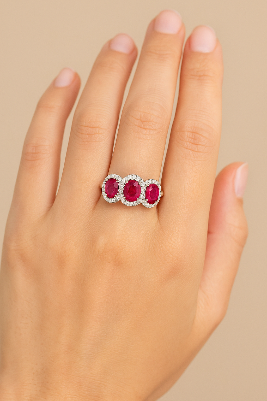 Triple Ruby Elegance – Three Oval Rubies (8x6 mm) with Round Diamond Halo Ring