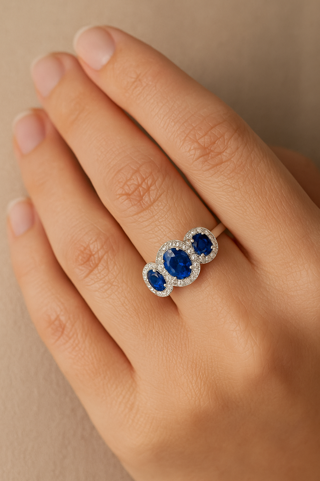 Trilogy Sapphire Ring – Center Oval 7x5 mm with Side 5x4 mm Sapphires and Diamond Halo